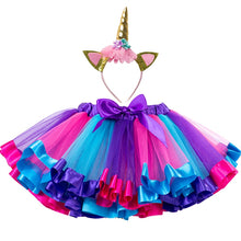 Load image into Gallery viewer, Colorful Tutu skirt for babies and toddlers. Has an array of colors  purple, pink, blue. The skirt comes with a unicorn headband that is adorned with pink flowers with a small purple and aqua flower at the top and a pointy gold accent. Skirt ties at waist and has an elastic band affect. 
